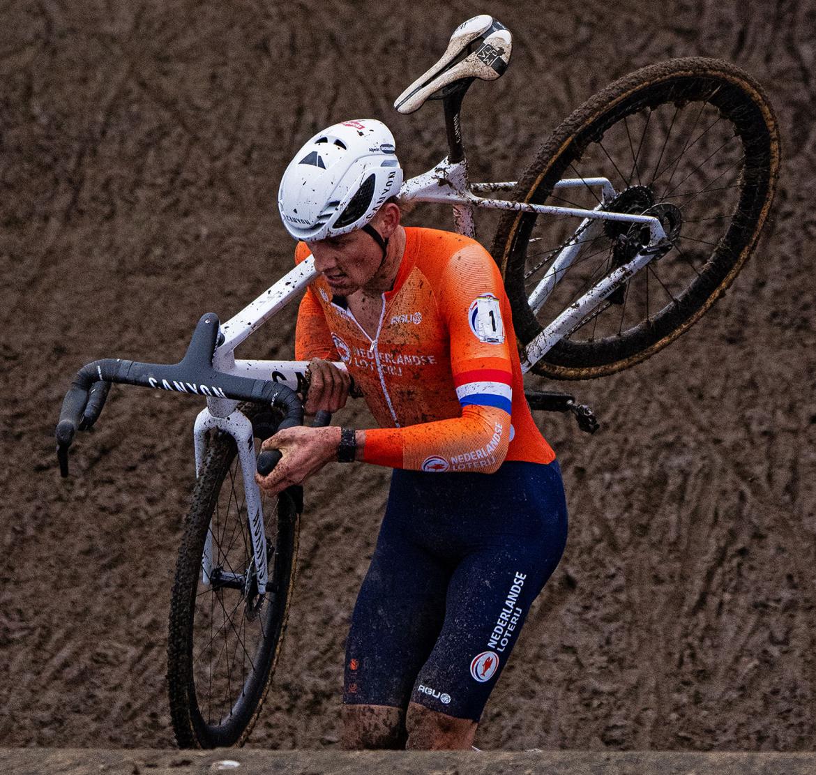 6x-Cyclocross-World-Champion-Mathieu-van-der-Poel-in-Tabor-2024_photo-by-Maty-Podrouzek_climbing-muddy-stairs.jpg